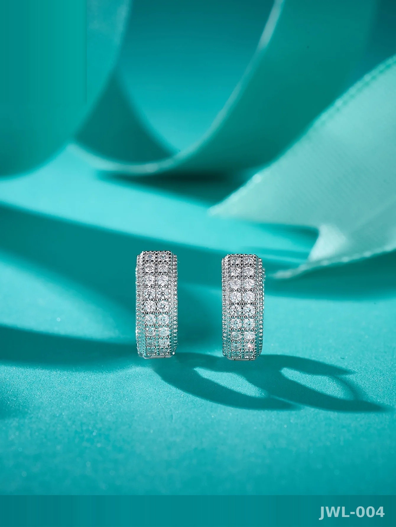 Iced Out Hoop Earrings · 3-Row Pavé · 925 Silver · D Color VVS Moissanite