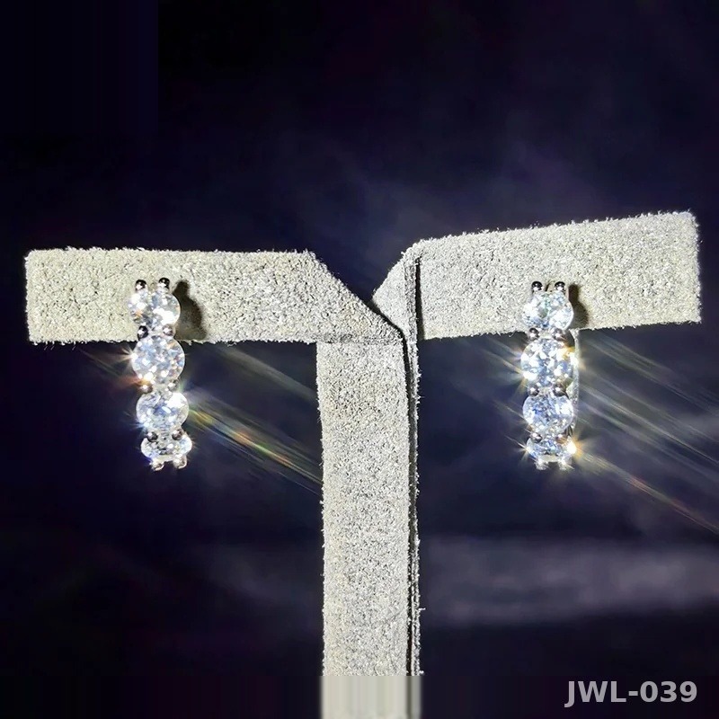 Iced Out Huggie Hoop Earrings · Rhodium · 925 Silver · VVS Moissanite